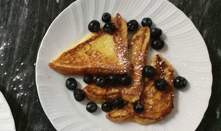 French toast with blueberries to be served with pure maple syrup