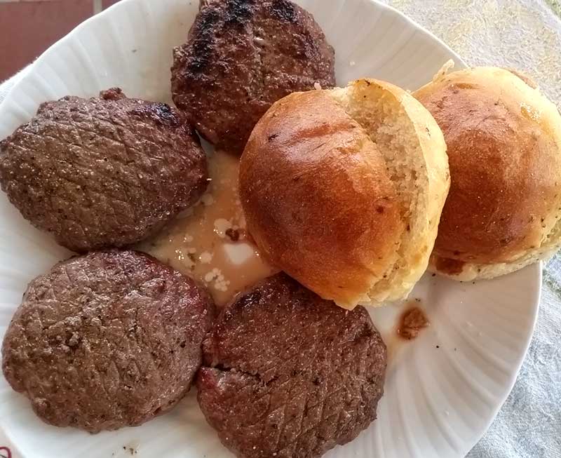 Charcoal-grilled grass-fed beef burgers, homemade organic buns
