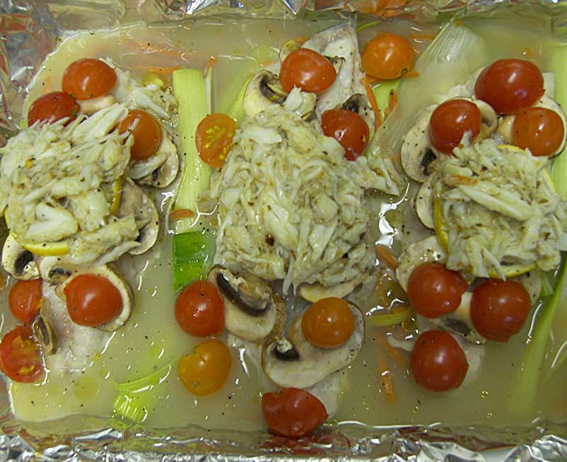 Fresh fish topped with crab, ready to bake en papillote